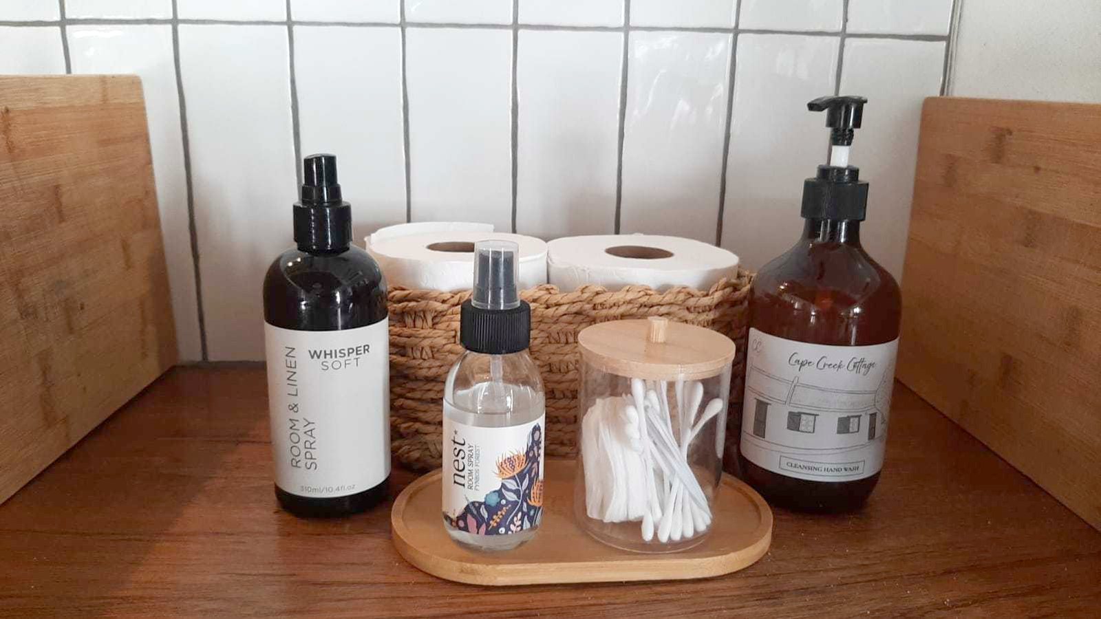 The Cape Creek Cottage branded hand wash, room spray and cotton buds set out in every bathroom at Cape Creek Retreat