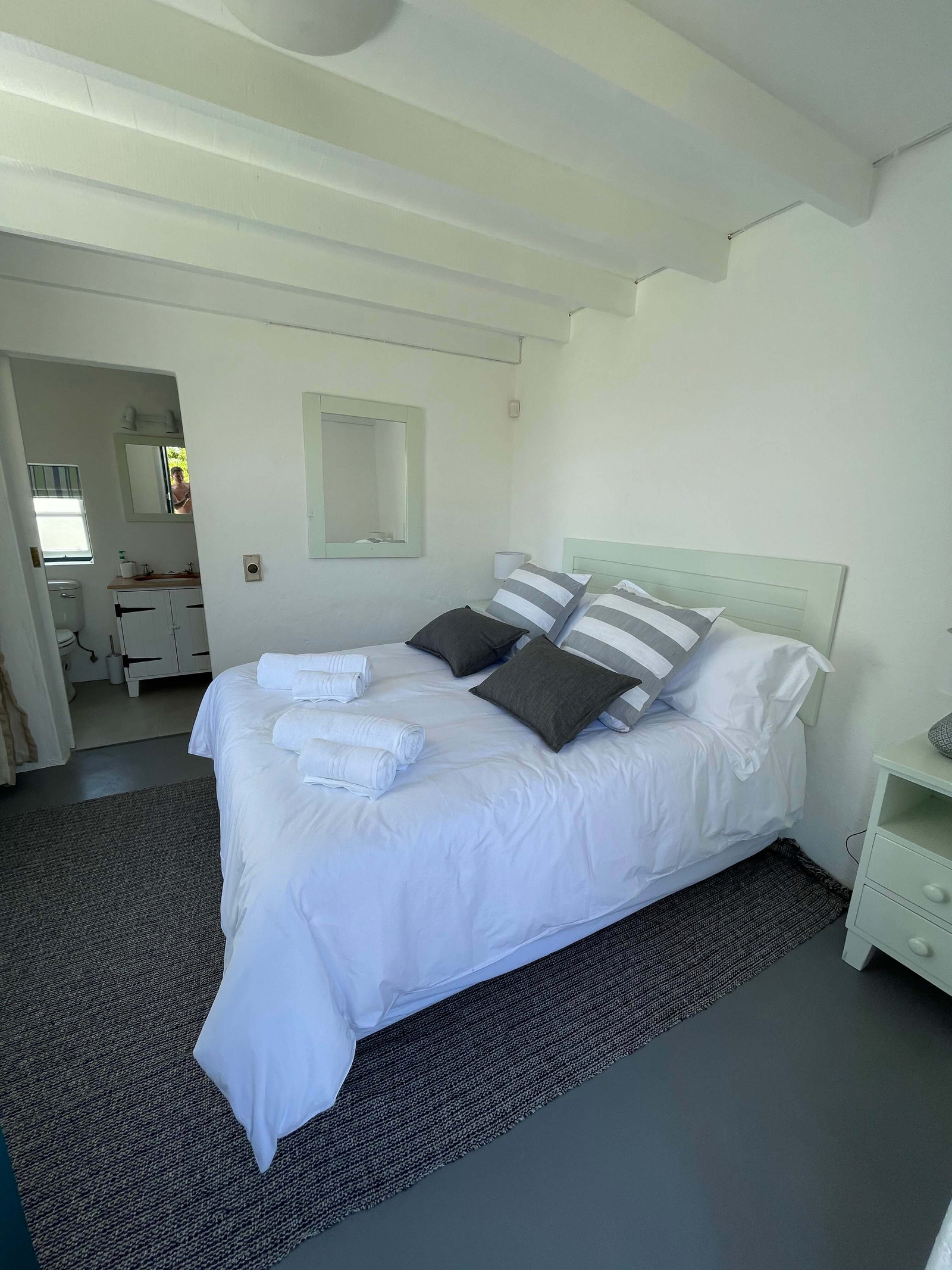 Oceanbreeze Cottage looking towards the doorway through to its private ensuite